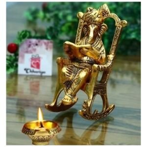 Golden Lord Ganesha Statue Sitting On A Rocking Chair And Reading Ramayan Showpiece